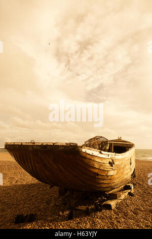 An old wooden boat on the beach, Brighton Beach, East Sussex England UK (See also image H63YJW) Stock Photo