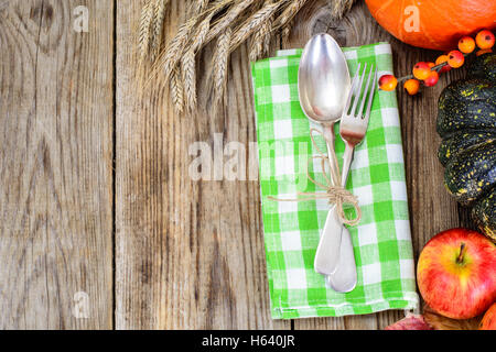 Seasonal tableware autumn pumpkins, apples, berries, cones with Stock Photo