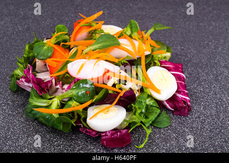 Frise Corn Salad with Chicory, Escarole, Crab Sticks and Quail E Stock Photo