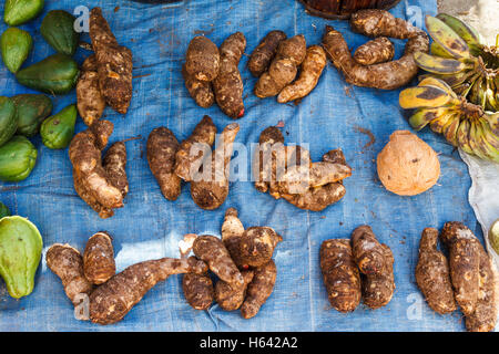 Cassava roots in a market. Stock Photo