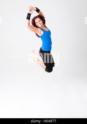 Sporty, young woman jumping Stock Photo