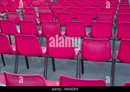 Rows of pink chairs Stock Photo