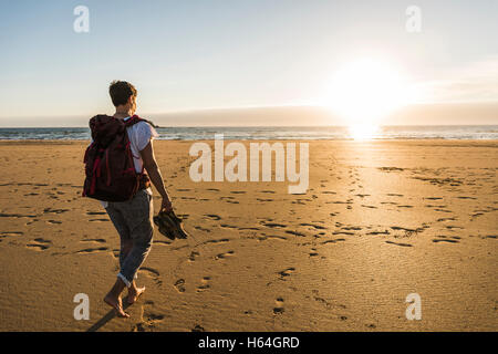 France, Bretagne, Finistere, Crozon peninsula, woman during beach hiking Stock Photo