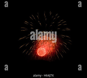Holiday fireworks of colored lights isolated on the black background of the night sky. Stock Photo