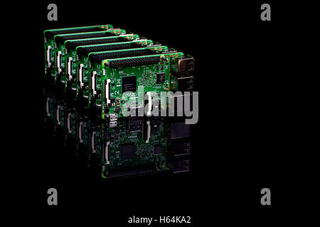 Circuit board with rj45, hdmi and usb connectors in a row on black reflective background Stock Photo