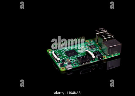 Circuit board with rj45, hdmi and usb connectors on black reflective background Stock Photo