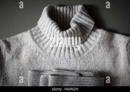 neck gray knitted sweater and knitted scarf folded Stock Photo