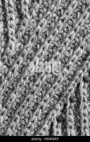 Gray knitting background texture. Knit woolen Fabric textile multicolor back. Stock Photo