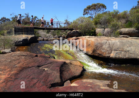 People crossing bridge over Hovea Falls, John Forrest National Park, Perth Hills, Western Australia. No MR or PR Stock Photo