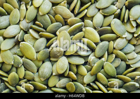 Organic pumpkin seeds or pepita closeup, can be used as a background Stock Photo