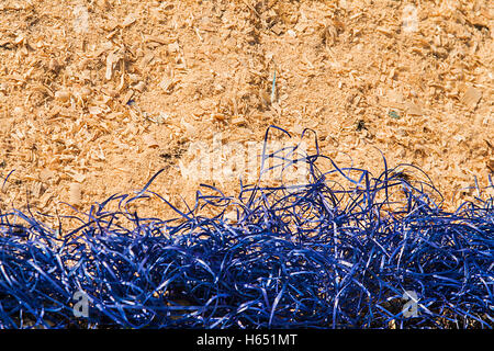 background of yellow decorative blue sisal and sawdust. Stock Photo