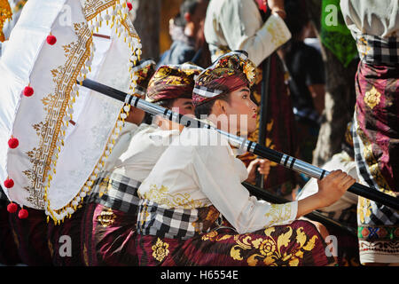 Denpasar, Bali island, Indonesia - June 11, 2016: Beautiful young man in traditional Balinese people costume sarong. Stock Photo