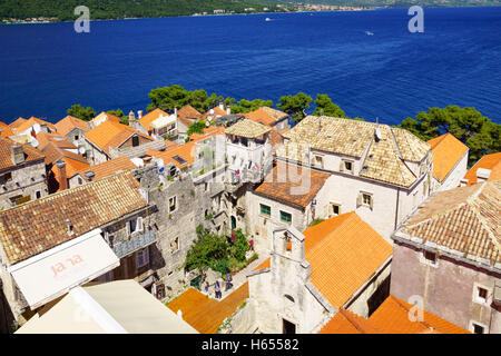 KORCULA, CROATIA - JUNE 25, 2015: Rooftop view of the old town, with the House of Maco Polo, locals and visitors, in Korcula, Cr Stock Photo