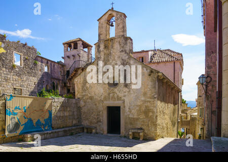 KORCULA, CROATIA - JUNE 26, 2015: The Saint Peter church and a map of the voyages of Marco Polo, in the old town of Korcula, Cro Stock Photo