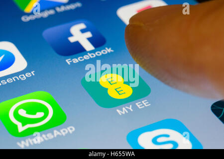 My EE mobile phone network provider online app close up on iPhone smart phone screen Stock Photo