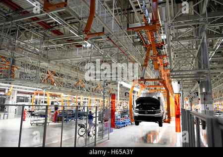 Wrzesnia, Poland. 24th Oct, 2016. Employees monitoring a Volkswagen Crafter van at the new Volkswagen Nutzfahrzeuge (Commercial Vehicles, VWN) factory in Wrzesnia, Poland, 24 October 2016. The factory was built in only two years. Volkswagen Commercial Vehicles invested roughly 800 million Euro in the 220 hectar area. Up to 3,000 employees are said to assemble the new Crafter at the factory. PHOTO: RAINER JENSEN/dpa/Alamy Live News Stock Photo
