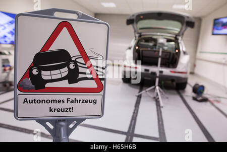 Karlsruhe, Germany. 09th Sep, 2016. A sign reading 'Self-driving car crossing' in front of a self-driving Audi in a room of the Karlsruhe Institute of Technology (KIT) in Karlsruhe, Germany, 09 September 2016. © dpa/Alamy Live News Stock Photo