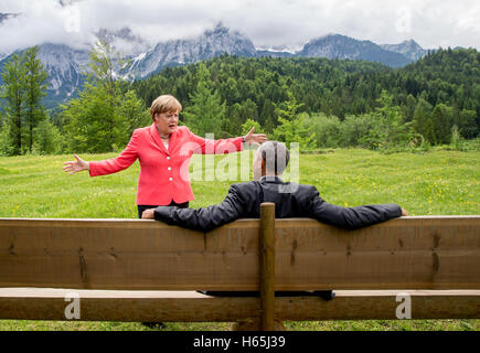 FILE - A file picture dated 08 June 2015 shows German Chancellor Angela Merkel speaking with US President Barack Obama in a meadow before the Wettenstein peak near Schloss Elmau in Elmau, Germany. US President Barack Obama is coming back to Germany for an unexpected visit. The White House announced on Tuesday in Washington that the outgoing president will be coming on 16 November from Athens to Berlin and then on 18 November traveling further to Lima, Peru for a summit. Photo: MICHAEL KAPPELER/dpa Stock Photo