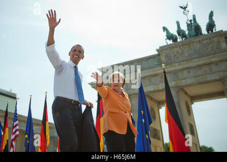 FILE - A file picture dated 19 June 2013 shows US President Barack Obama (L) waving next to German Chancellor Angela Merkel after his speech in front of the Brandenburg Gate in Berlin, Germany. US President Barack Obama is coming back to Germany for an unexpected visit. The White House announced on Tuesday in Washington that the outgoing president will be coming on 16 November from Athens to Berlin and then on 18 November traveling further to Lima, Peru for a summit. Photo: MICHAEL KAPPELER/dpa Stock Photo