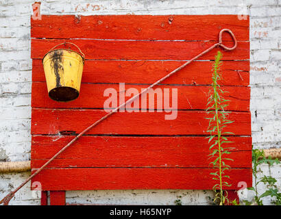 Old fire shield with fire extinguishing tools. Stock Photo