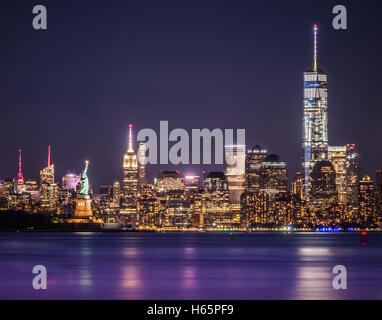 One World Trade Center, The Empire State and the Statue of Liberty captured together at night. Long Exposure photography Stock Photo