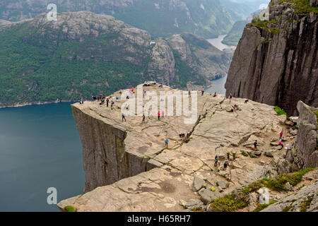 People watching the landscape from the famous Pulpit or Preikestolen rock, view from above Stock Photo