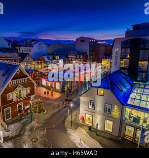 Aerial view of downtown Reykjavik during Christmas, including a small outdoor skating rink. This image is shot with a drone. Stock Photo