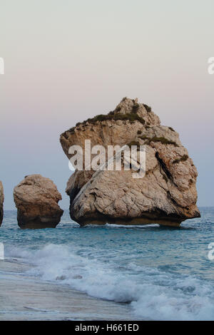 Rock formations on the beach at the ‘blue hour’, Petra Tou Romiou, Aphrodite's Birthplace, Cyprus Stock Photo