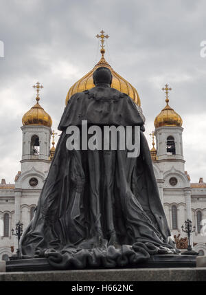 Statue of Tsar Alexander II looking at Cathedral of Christ the Savior Stock Photo