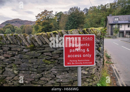 Private Road sign with parking restriction details, Grasmere village, Lake District National Park, Cumbria UK Stock Photo