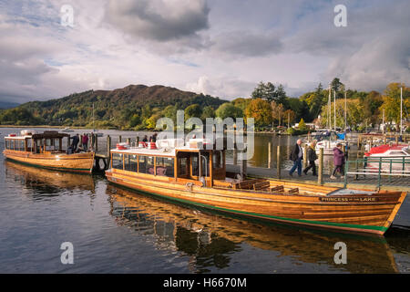 Tourists departing cruise boats at Waterhead, Ambleside on Lake Windermere, Lake District, Cumbria, UK Stock Photo