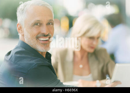 Portrait smiling businessman at sidewalk cafe Stock Photo