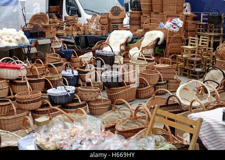 Market stall full of wicker baskets and seats Stock Photo