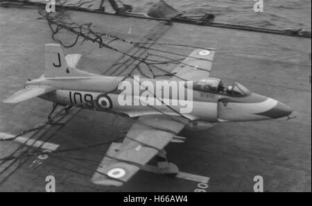 Royal Navy Fleet Air Arm Supermarine Attacker aircraft crash landed on the flight deck of aircraft carrier HMS Eagle after missing the arrestor wires. The Attacker was the first jet aircraft to see service with the Fleet Air Arm. Stock Photo