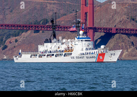 USCGC Mellon (WHEC-717), Hamilton-class high endurance cutter, passes under the Golden Gate Bridge. Stock Photo