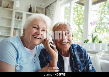 Senior couple using mobile phone Stock Photo
