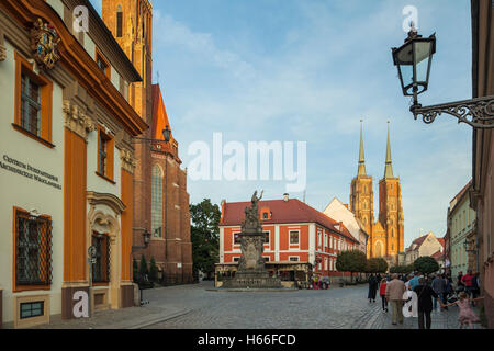Sunset on Ostrow Tumski in Wroclaw, Lower Silesia, Poland. Iconic medieval cathedral towers in the distance. Stock Photo