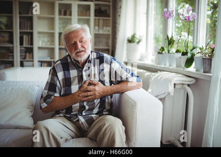 Senior man suffering from chest pain Stock Photo