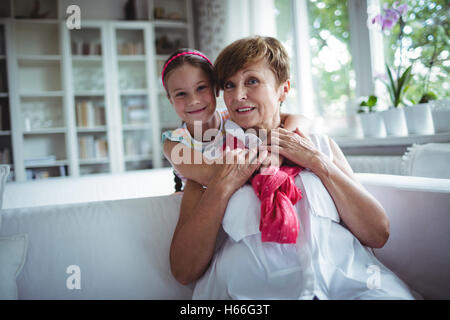 Portrait of granddaughter embracing her grandmother Stock Photo