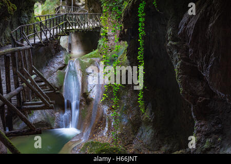 Grotte del Caglieron. The Caglieron caves. Waterfall and wooden walkway.  Fregona. Veneto. Italy. Europe. Stock Photo