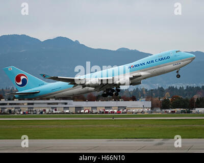 A Korean Air Cargo Boeing 747 (747-400F) HL7434 air cargo freighter taking off from Vancouver International Airport Canada Stock Photo