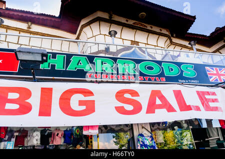 Shop in Turkey called 'Harrods' selling counterfeit clothing, sportswear and handbags, with sign saying 'Big Sale' Stock Photo