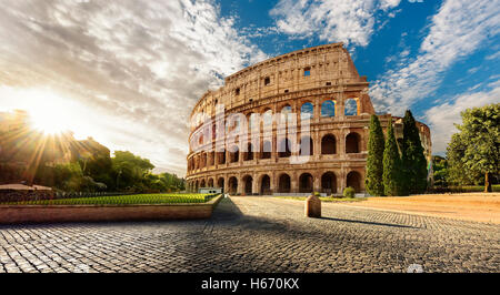 Colosseum in Rome and morning sun, Italy Stock Photo