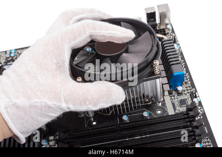 Installing CPU cooler on modern PC computer motherboard Stock Photo