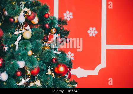 eautiful new year red room with decorated Christmas tree. The idea for postcards. Soft focus. Shallow DOF Stock Photo