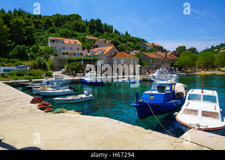 SUDURAD, CROATIA - JUNE 27, 2015: Scene of the fishing port, with boats, locals and tourists, in the village Sudurad, Sipan Isla Stock Photo