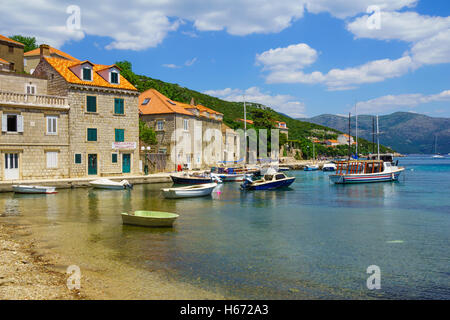 SUDURAD, CROATIA - JUNE 27, 2015: Scene of the fishing port, with boats, locals and tourists, in the village Sudurad, Sipan Isla Stock Photo