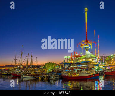 The amusement park becomes one of the brightest, noisiest and colorful places in the evening, Eilat Stock Photo