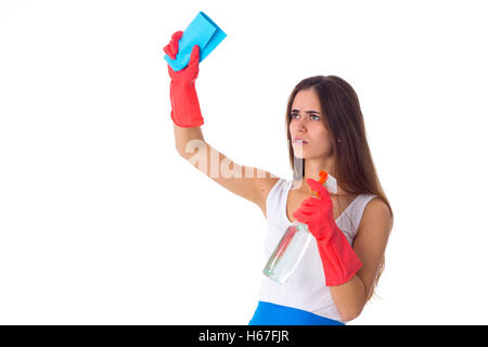 Woman using duster and detergent Stock Photo