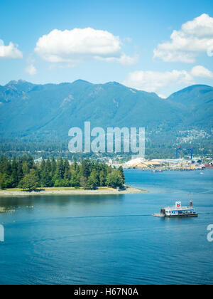 Elevated view: Coal Harbour, the floating Chevron fuel station, Stanley Park, Vancouver Harbour, and Grouse Mountain. Vancouver. Stock Photo